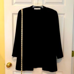 Tuxedo jacket worsted wool jacket with silk  lapel and shoulder pads and lined.